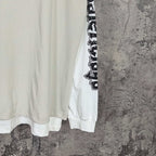 Balenciaga long-sleeve T-shirt, white torso with black vertical sleeve text