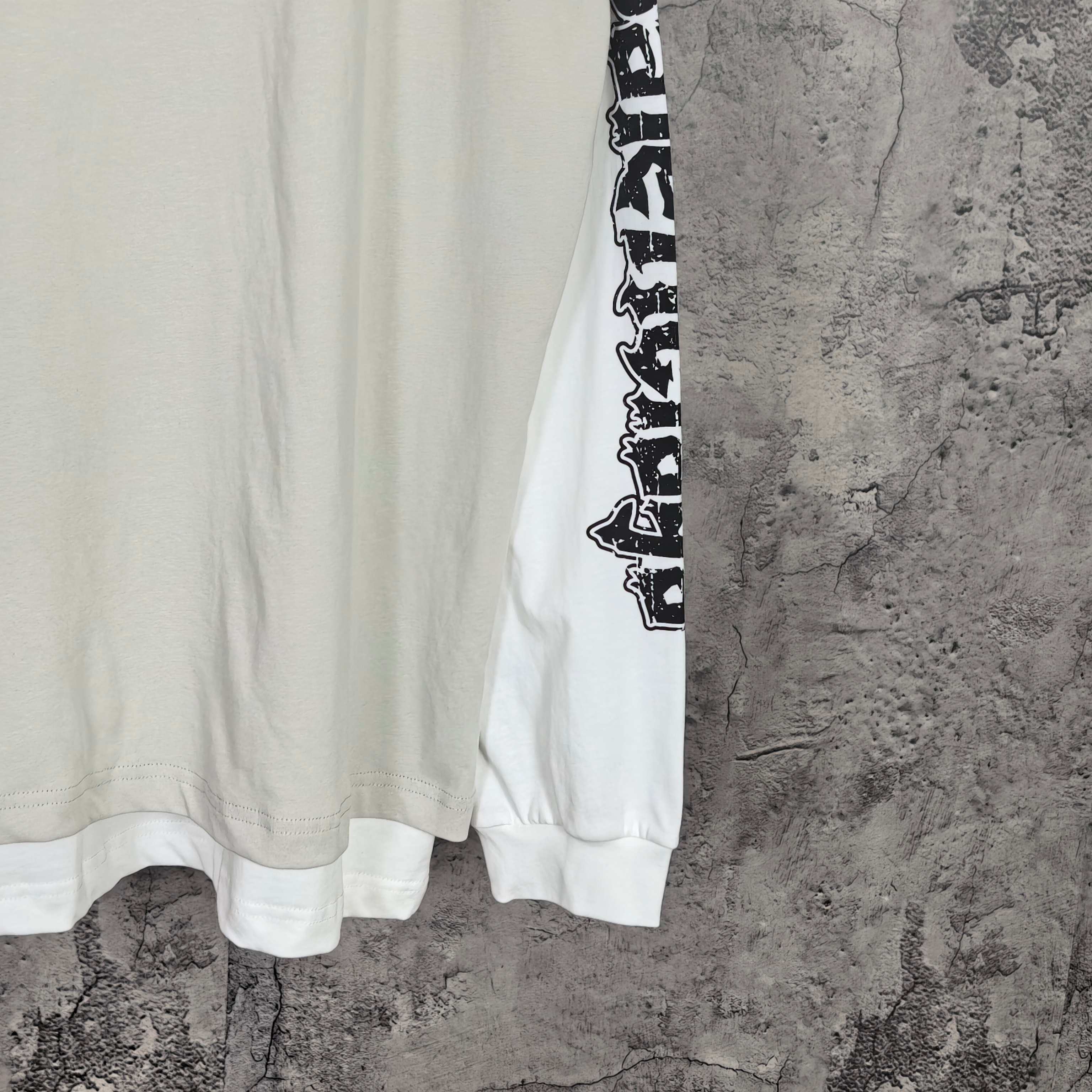 Balenciaga long-sleeve T-shirt, white torso with black vertical sleeve text