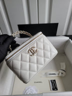Chanel bag, white quilted leather with gold chain strap and top zip front