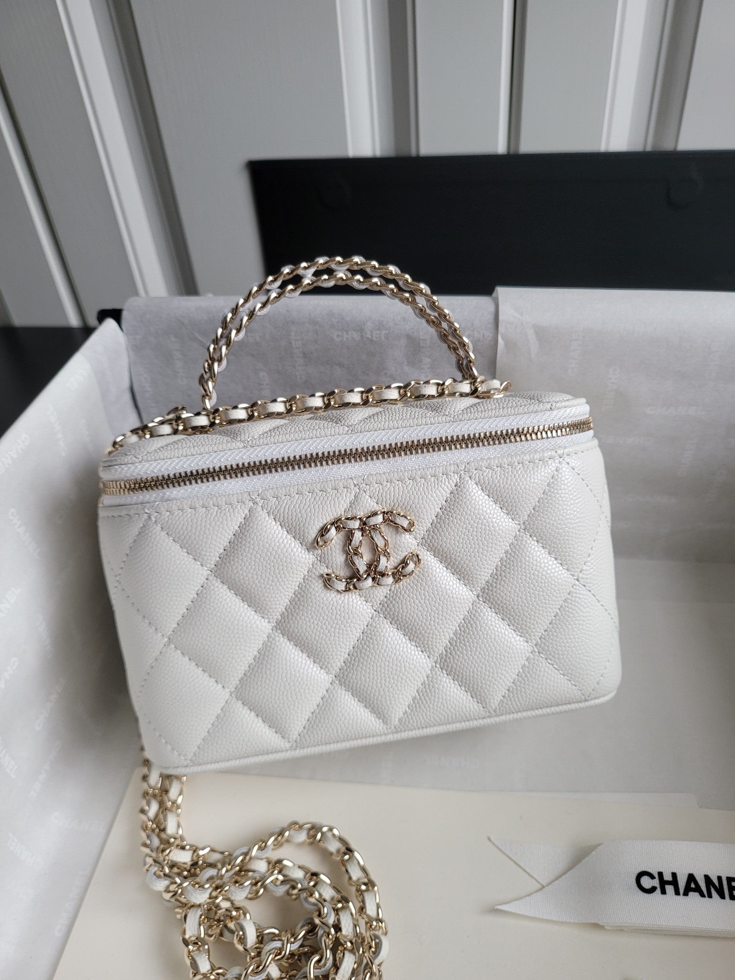 Chanel bag, white quilted leather with gold chain and front CC clasp