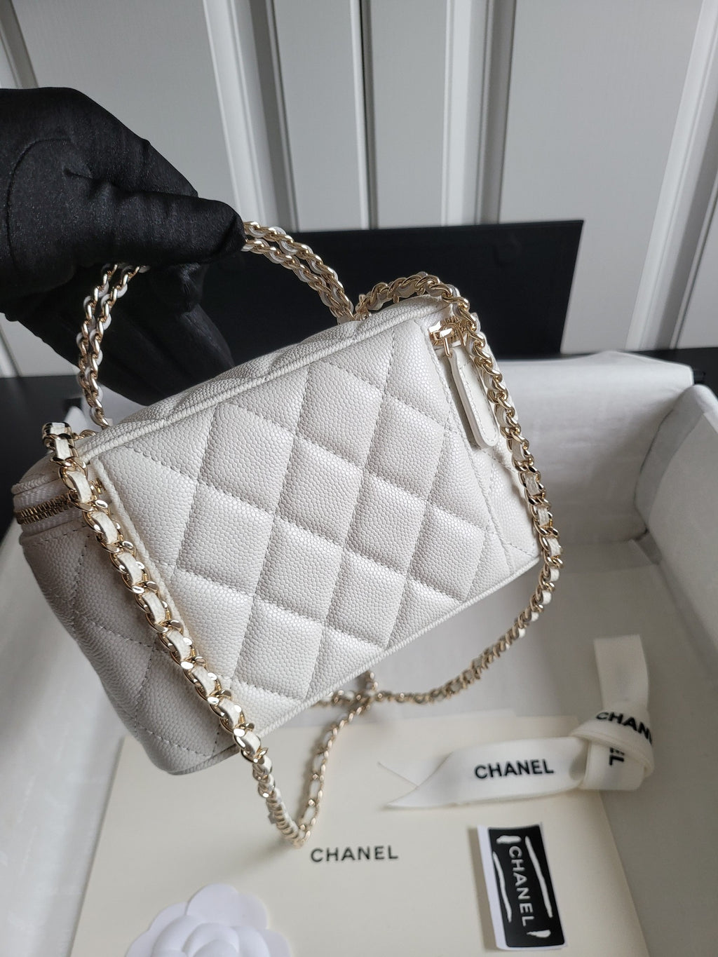 Chanel bag, white quilted leather shoulder bag with gold chain strap and top zip