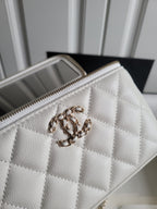Chanel white quilted crossbody bag close-up with chain handle and zip edge