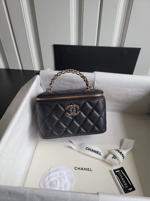 Chanel quilted mini handbag in dark color with chain top handle and front logo