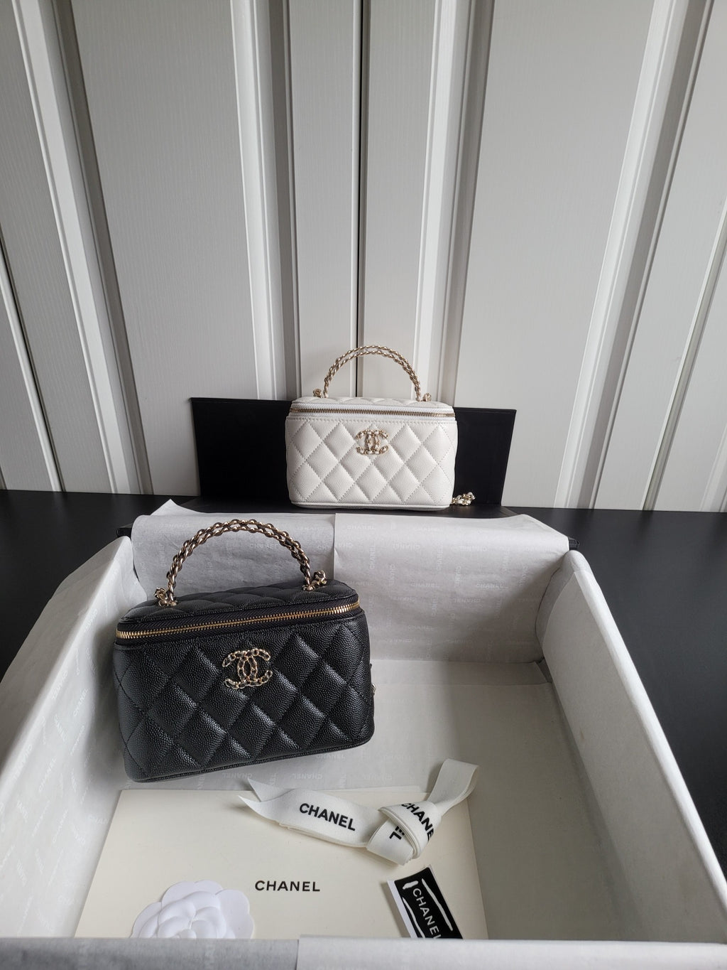 Chanel quilted handbag set: white mini bag and black mini bag with chain straps