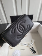 Chanel quilted mini handbag in dark color with embossed CC logo on front