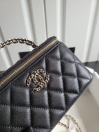 Chanel quilted mini handbag close-up: gold-tone CC logo and chain strap detail