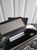 Chanel quilted bag interior with zipped pocket and card slot divider, gold zipper trim