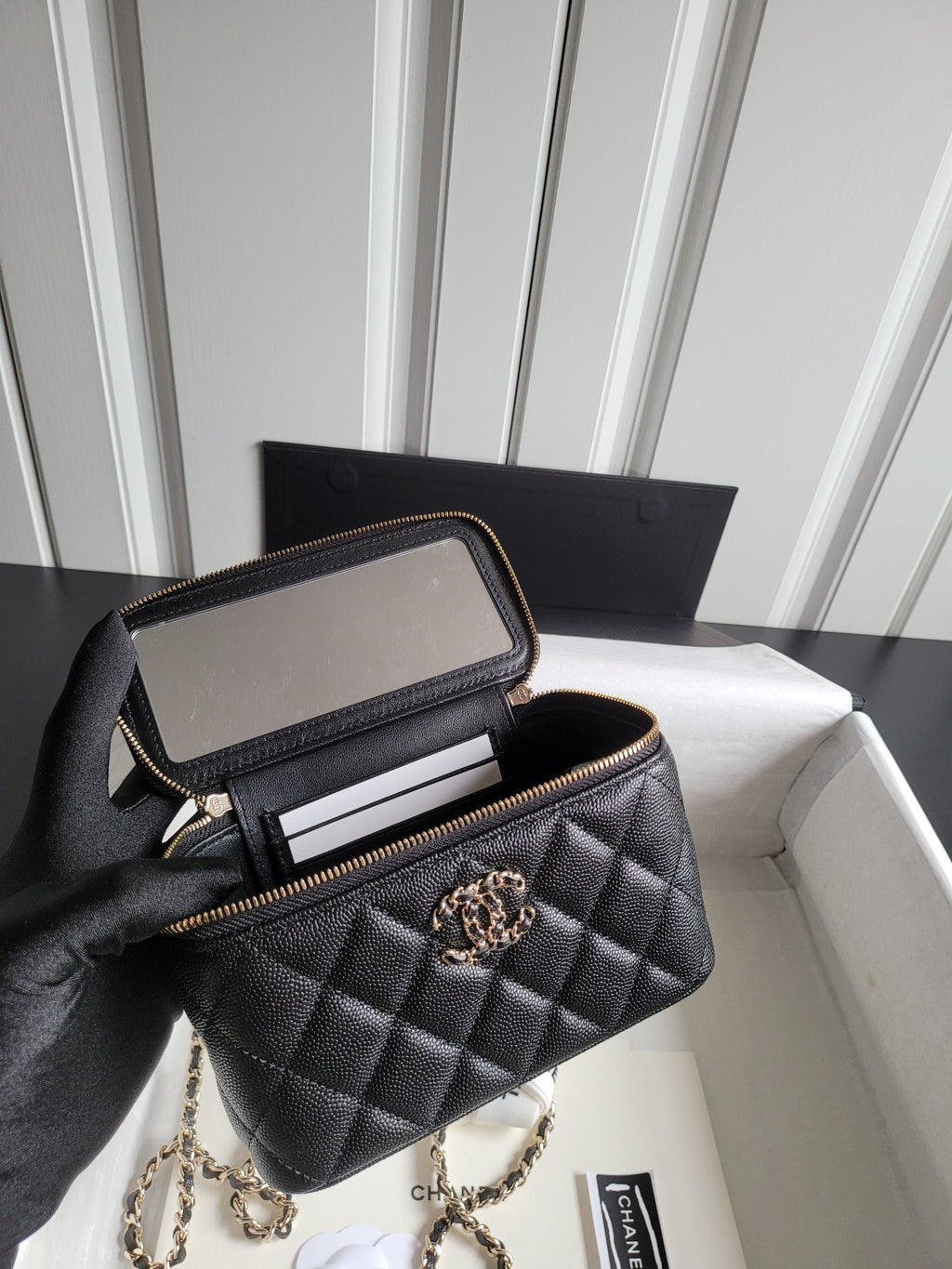 Chanel quilted shoulder bag with open zip top and interior card slots, gold trim