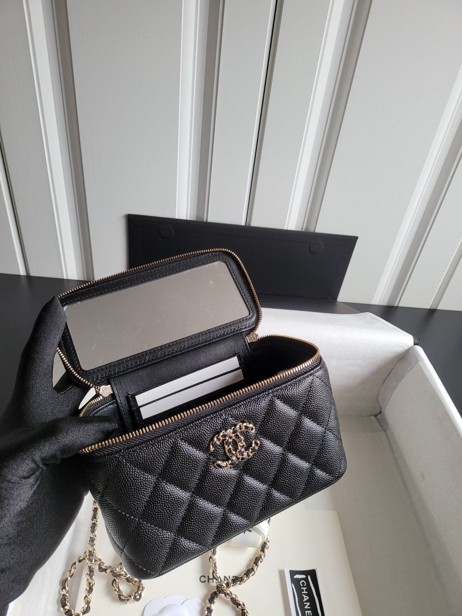 Chanel quilted shoulder bag with open zip top and interior card slots, gold trim