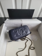 Chanel small shoulder bag with chain strap, dark navy logo and front flap closure