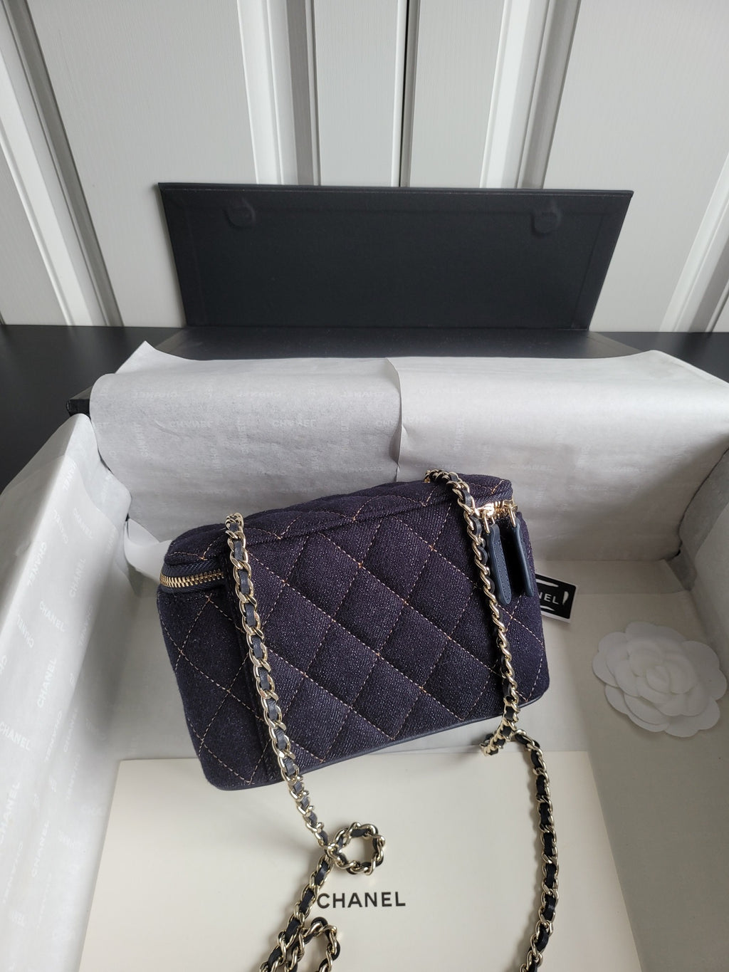 Chanel quilted mini shoulder bag with chain strap, dark navy and gold zipper trim