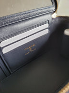Card holder slot in Chanel quilted bag, with embossed logo