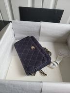 Quilted navy Chanel shoulder bag with chain strap and front flap, gold CC emblem