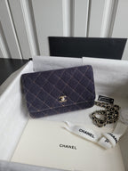 Quilted navy Chanel flap shoulder bag with chain strap and gold CC turn-lock