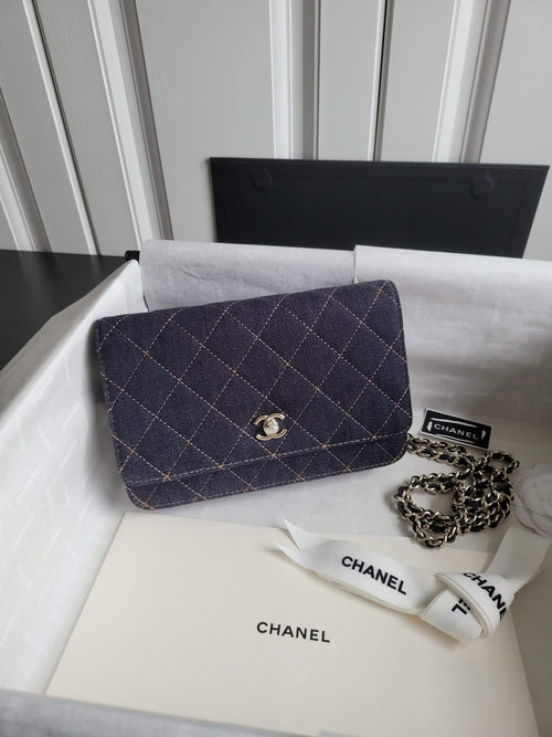 Quilted navy Chanel flap shoulder bag with chain strap and gold CC turn-lock