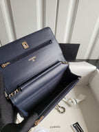 Navy Chanel leather shoulder bag with front flap, chain strap, and gold hardware