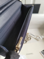 Navy Chanel bag interior lining with zippered pocket and gold-tone zipper pull