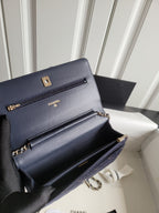 Navy Chanel flap shoulder bag, open interior with chain strap and zipper pocket