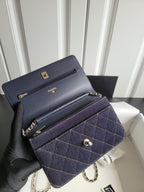 Navy quilted Chanel shoulder bag with chain strap and flap, button clasp