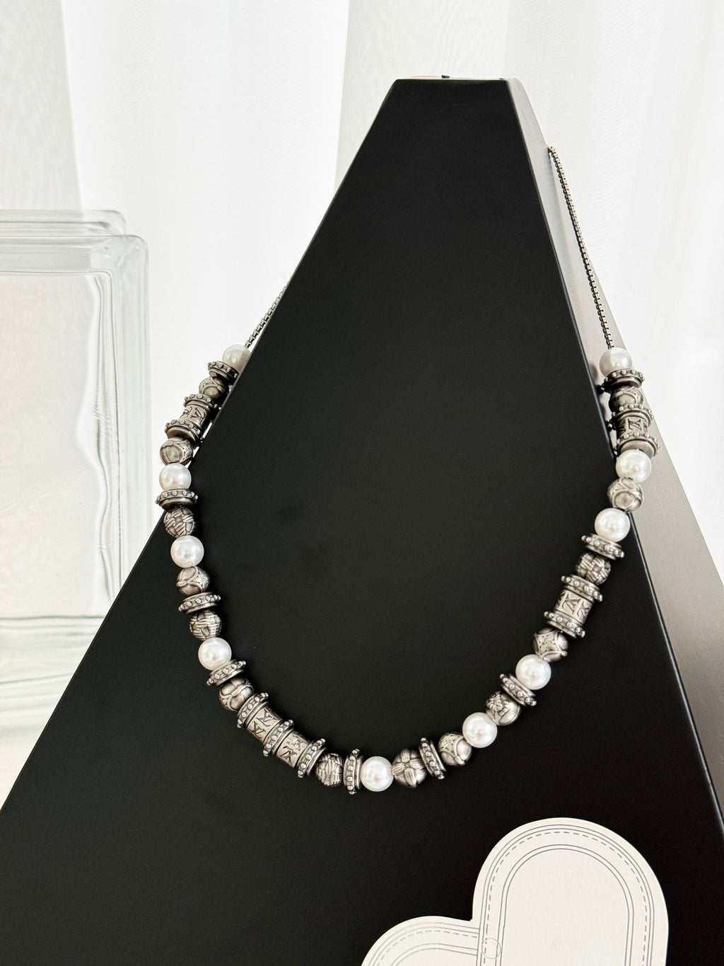 Louis Vuitton beaded necklace with pearl-like beads and silver-tone logo stations