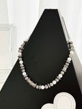 Louis Vuitton beaded necklace with pearl-like beads and silver-tone logo stations