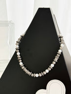 Louis Vuitton beaded necklace with pearl-like beads and silver-tone logo stations