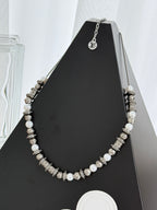 Louis Vuitton beaded necklace with pearl-like beads and silver-tone logo stations