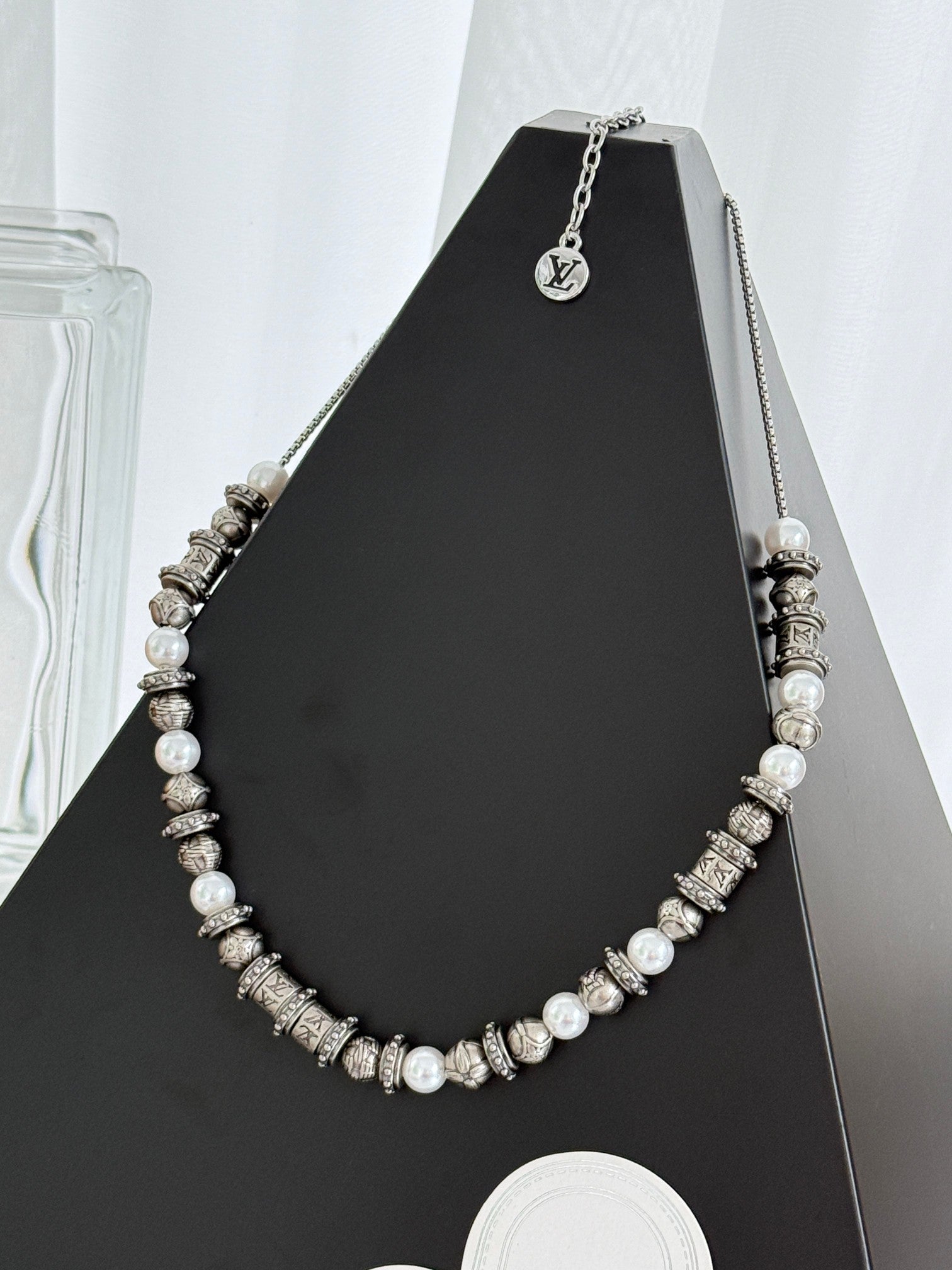 Louis Vuitton beaded necklace with pearl-like beads and silver-tone logo stations
