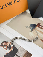 Silver-tone beaded bracelet with pearl accents and chain drop, LV logo charm