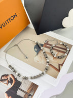 Silver-tone beaded charm bracelet with pearl beads and two LV logo charms, chain
