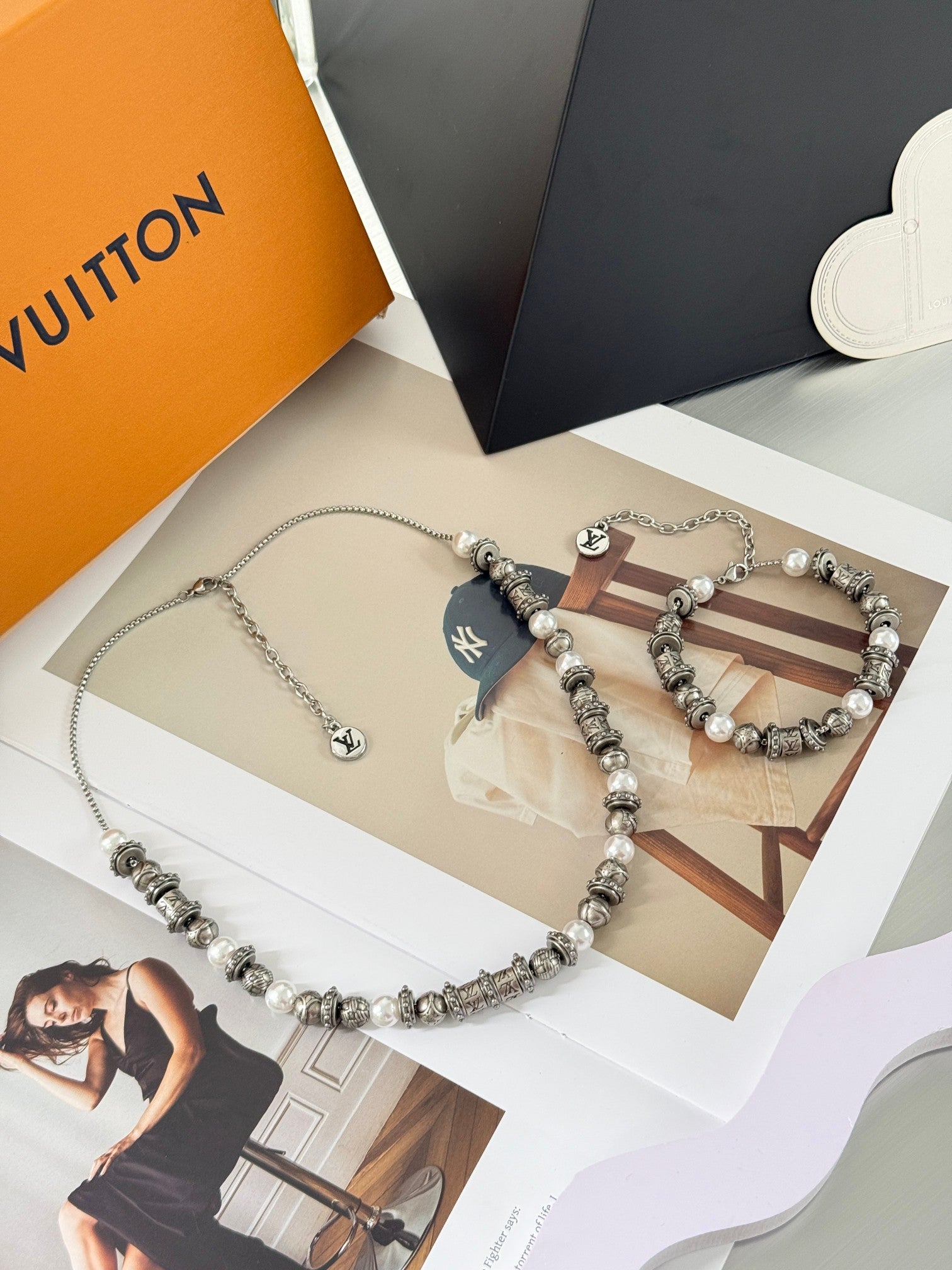 Silver-tone beaded charm bracelet with pearl beads and two LV logo charms, chain