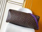 Brown monogram duffle bag with purple side strap and top handles