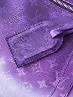 Purple textured leather panel with embossed monogram and stitched leather edge