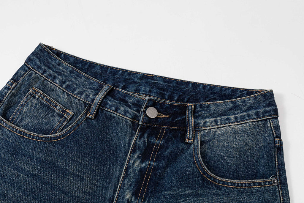 Prada denim pants waistband close-up with belt loops and top button closure