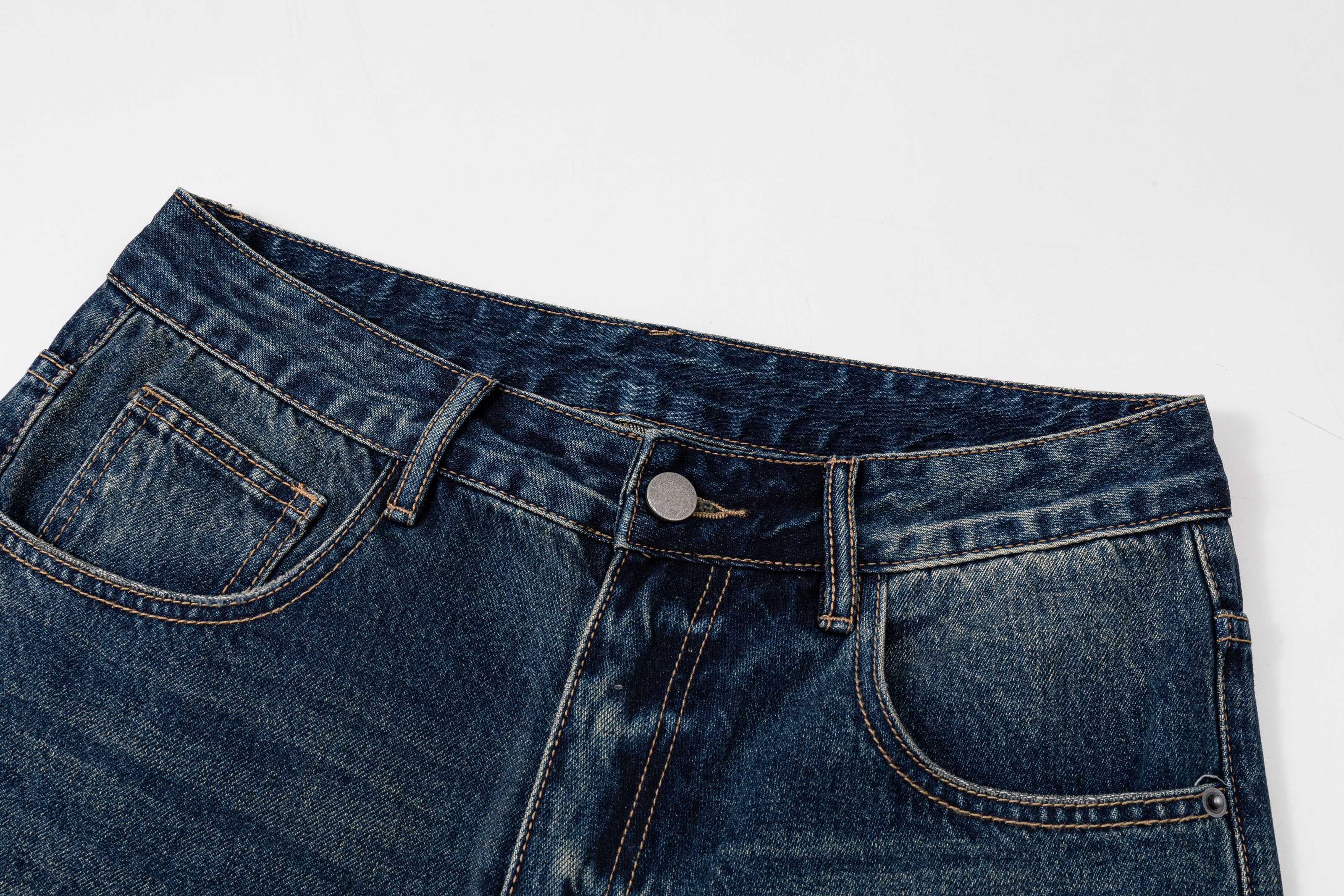 Prada denim pants waistband close-up with belt loops and top button closure