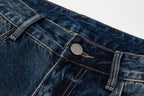 Prada denim pants front waist close-up with button and belt loop detail