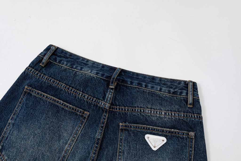 Prada denim pants back waist close-up with rear pocket and stitched detailing