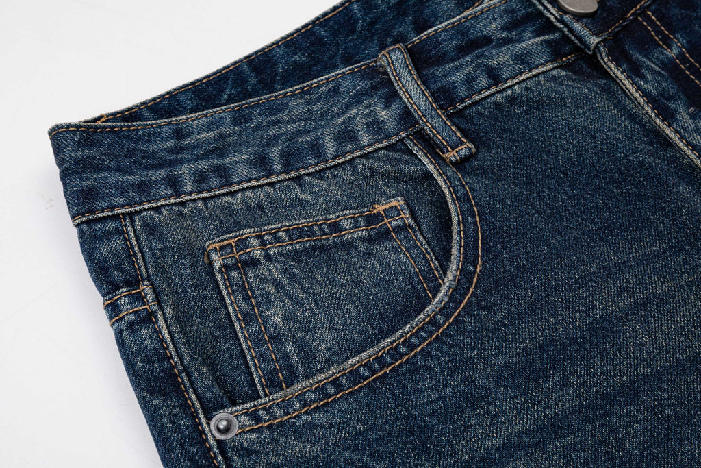 Prada denim pants front pocket close-up with contrast stitching and rivet