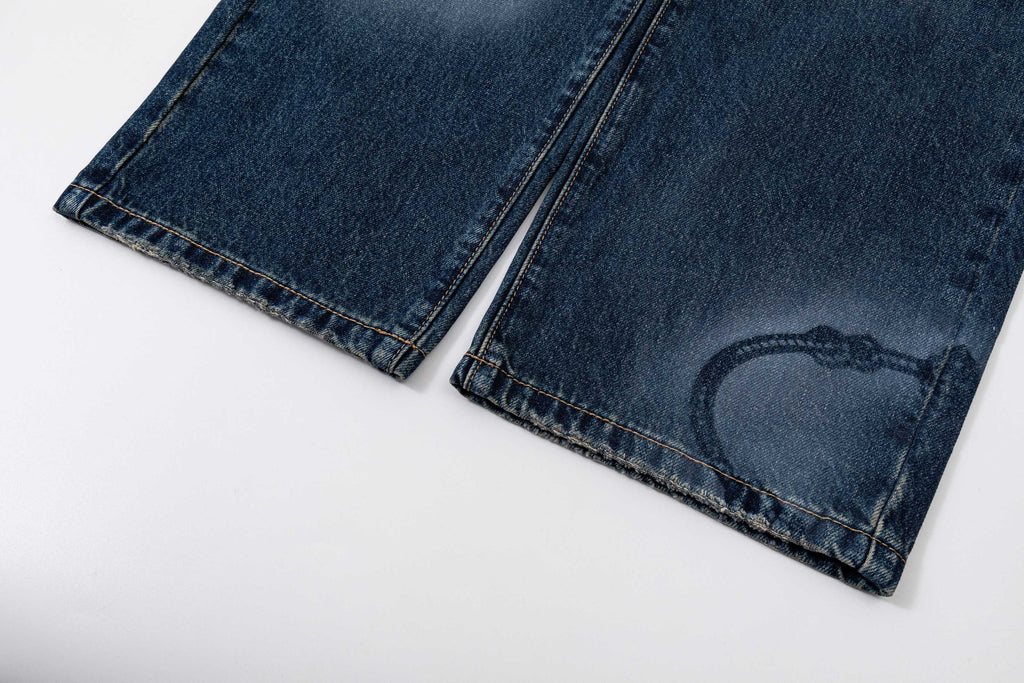 Prada denim pants in dark blue with visible hem and stitching