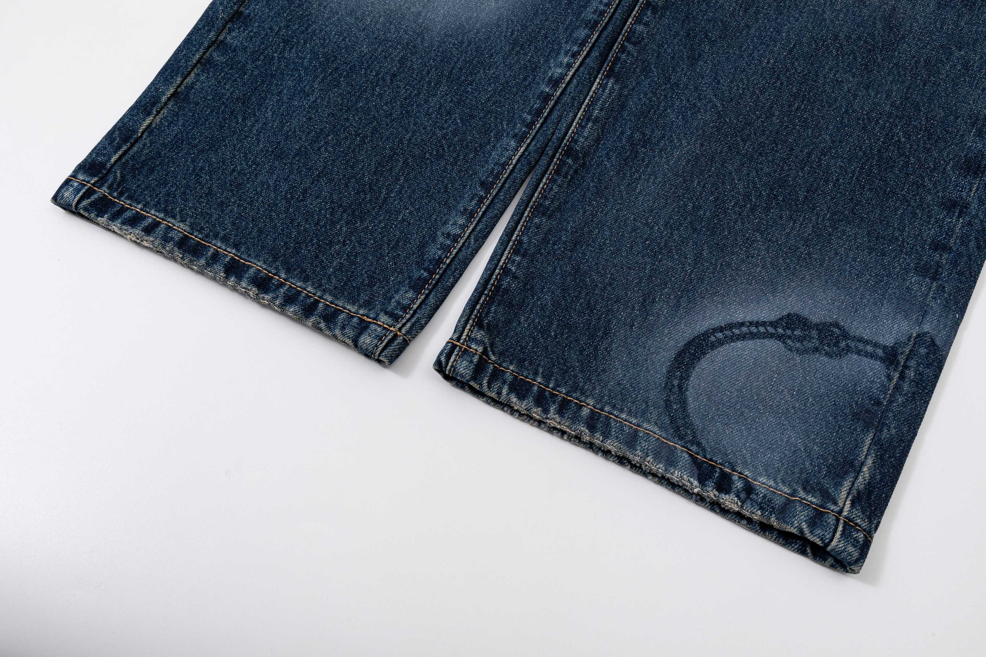 Prada denim pants in dark blue with visible hem and stitching