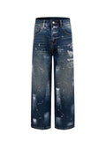 Prada denim pants in dark blue with paint splatter, wide straight legs