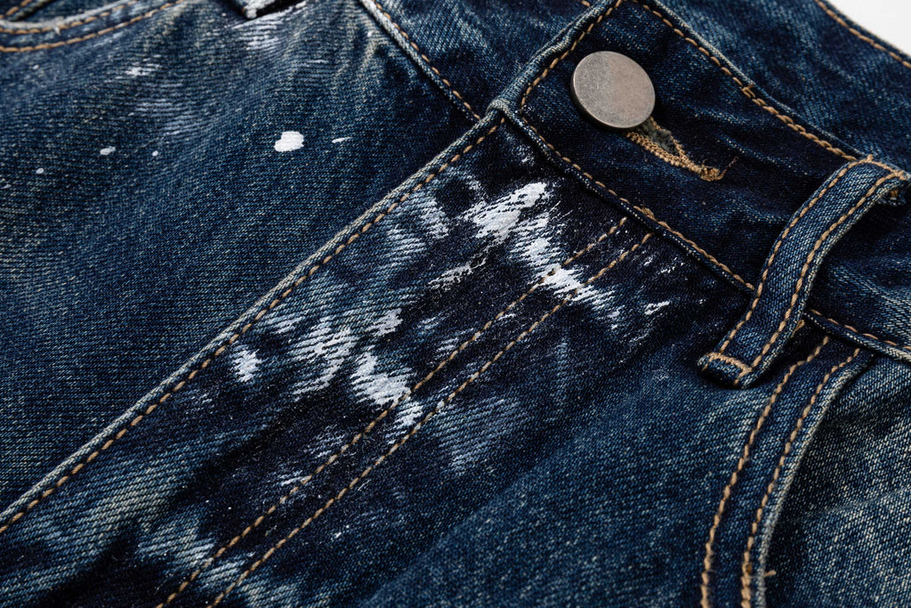 Prada denim pants close-up of belt loop and coin button, dark blue wash