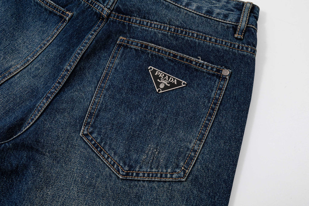 Prada denim pants back pocket with Prada logo patch, dark blue denim