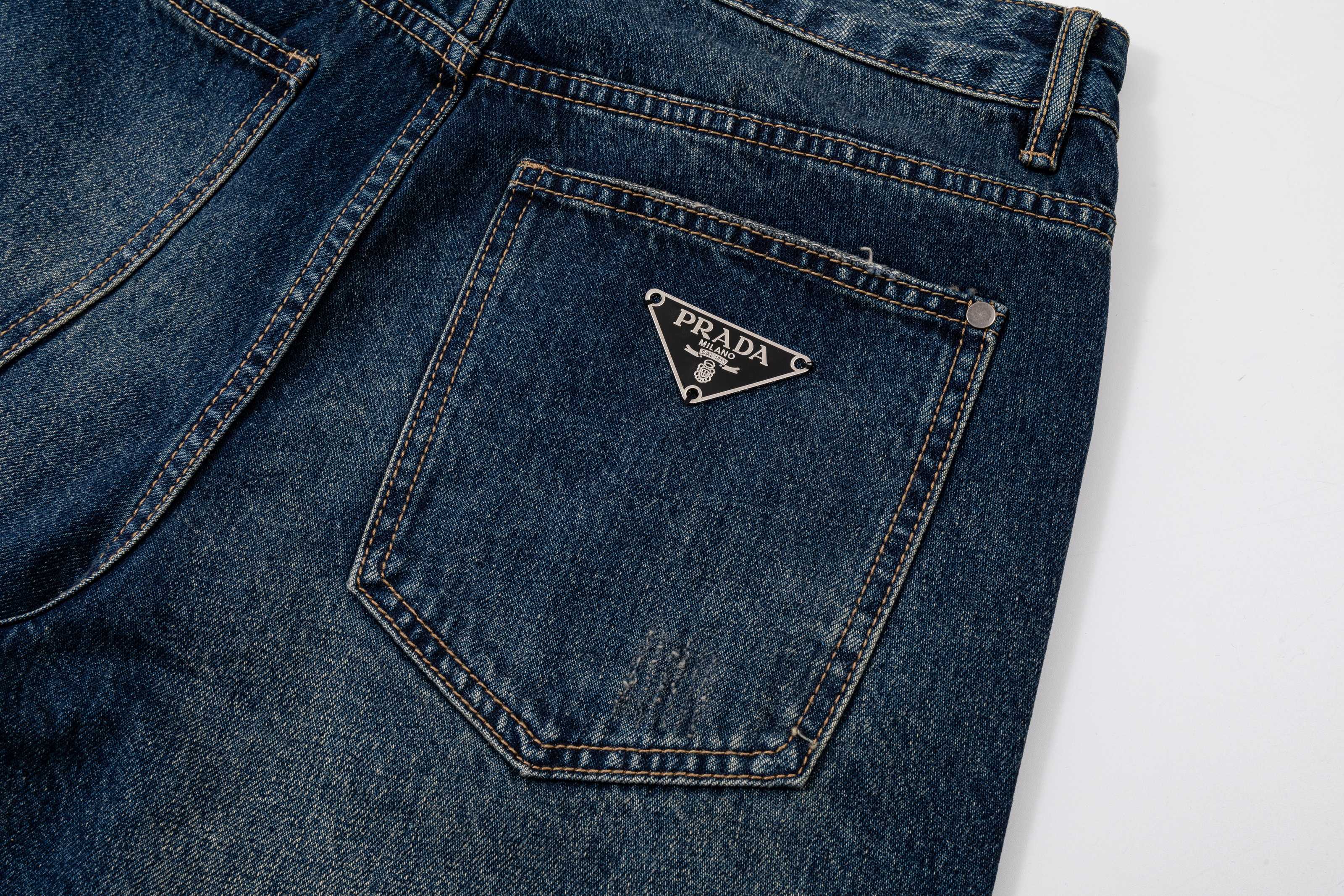 Prada denim pants back pocket with Prada logo patch, dark blue denim