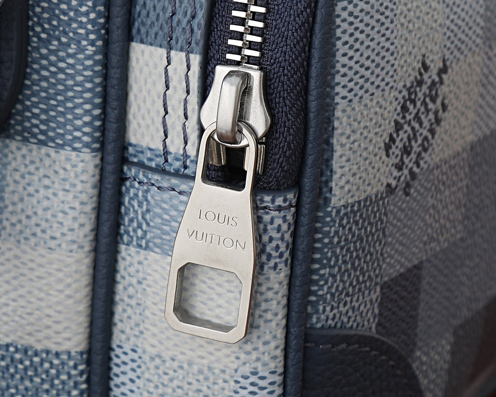 Louis Vuitton zip pull tag and key hook hardware on blue check canvas