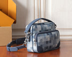 Louis Vuitton crossbody bag with blue check canvas, front zip pocket, and adjustable strap