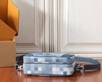 Louis Vuitton crossbody bag in blue check pattern with adjustable shoulder strap