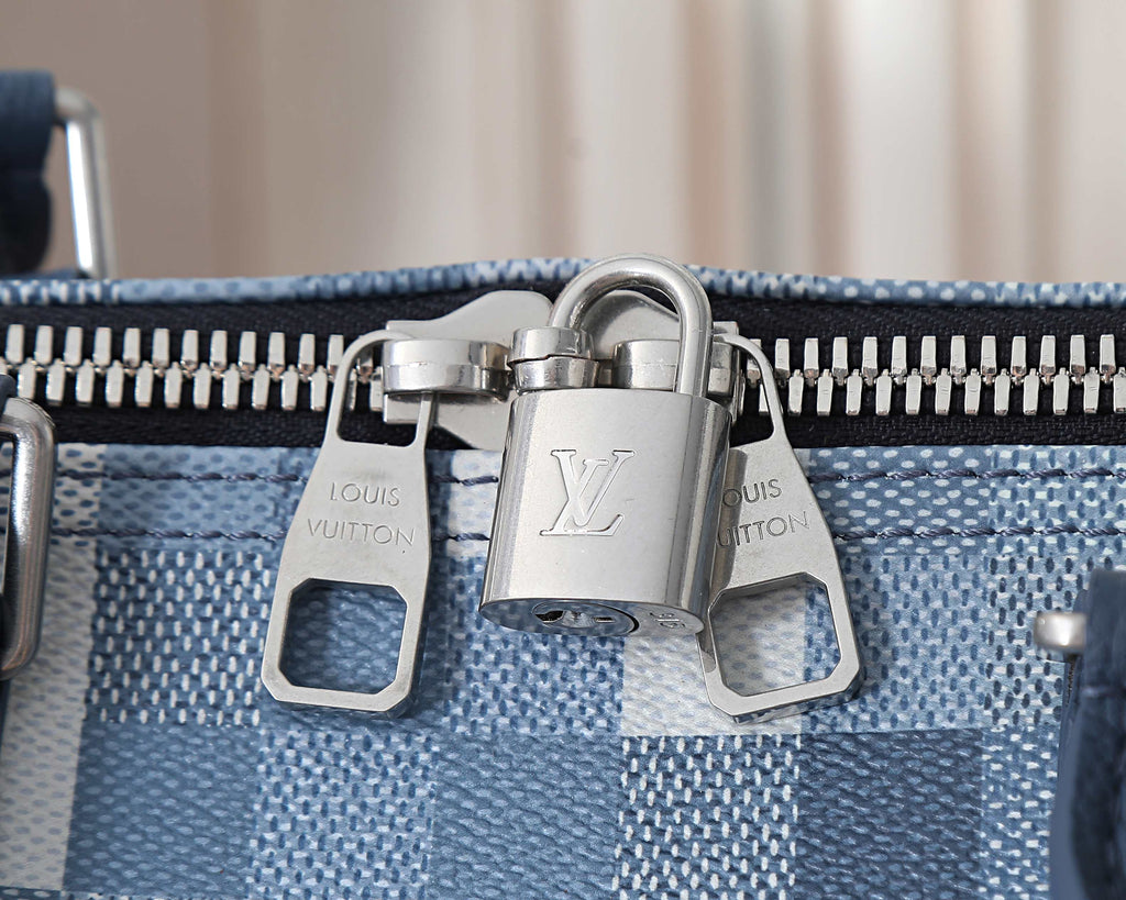 Louis Vuitton duffel bag front zipper and metal hardware close-up
