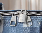 Louis Vuitton duffel bag front zipper and metal hardware close-up