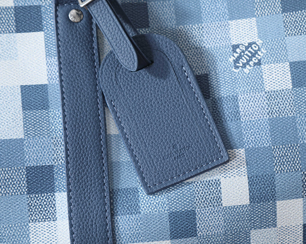 Louis Vuitton duffel bag leather luggage tag on blue checkered canvas